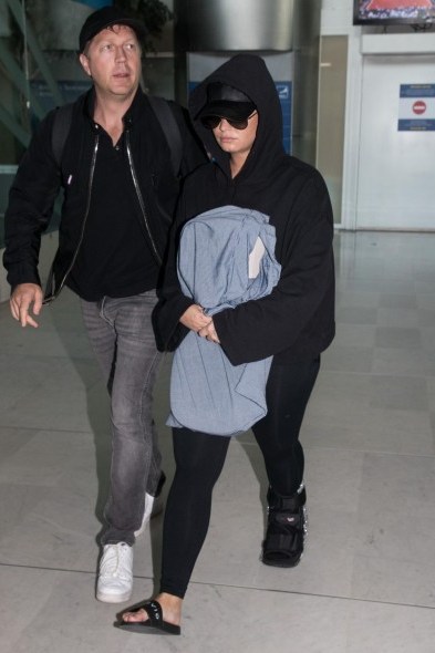 Demi Lovato black slip-on flats, GIVENCHY Logo sliders, arriving at Charles-De-Gaulle Airport in Paris, 3 June 2018 | celebrity travel style - flipped