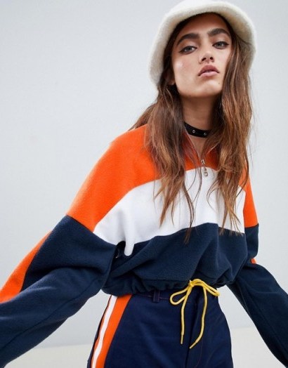 The Ragged Priest cropped fleece with half zip in orange – sporty colourblock top - flipped