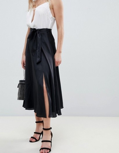 ASOS DESIGN Petite satin midi skirt with self tie in black | flowy front slit skirts