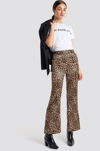 NA-KD Trend Flared Shiny Leo Pants Brown | animal print trousers - flipped