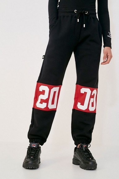 GCDS Classic Black Sweatpants in Black – cuffed logo joggers - flipped