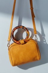 Anthropologie Lucite-Handled Crossbody Bag in Yellow / round tortoiseshell pattern top handle