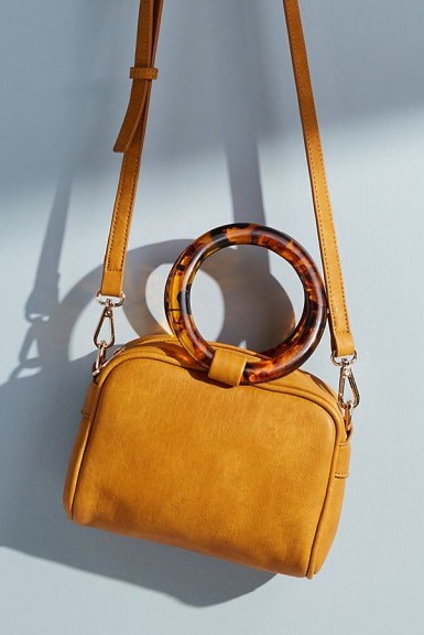 Anthropologie Lucite-Handled Crossbody Bag in Yellow / round tortoiseshell pattern top handle - flipped