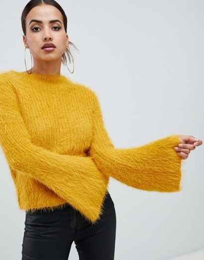 PrettyLittleThing flared sleeve fluffy jumper in yellow | wide sleeved sweater - flipped
