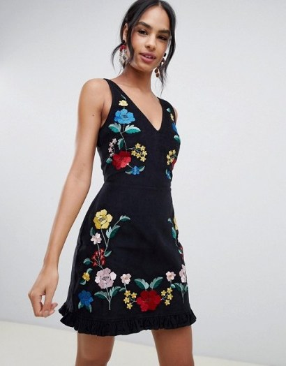 ASOS DESIGN mini dress in cord with floral embroidery in black – pretty party dresses - flipped