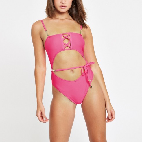 RIVER ISLAND Bright pink cut out tie swimsuit – strappy swimwear