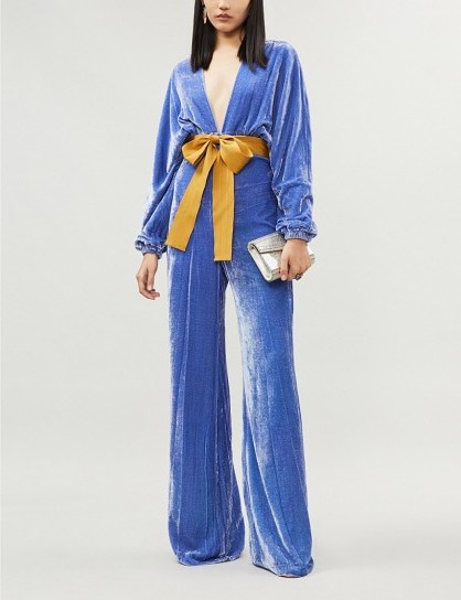 SILVIA TCHERASSI Eleanor bow-detail velvet flared jumpsuit in blue hydrangea | statement jumpsuits - flipped