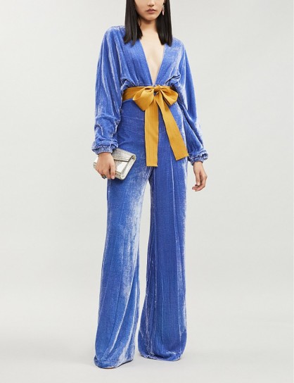 SILVIA TCHERASSI Eleanor bow-detail velvet flared jumpsuit in blue hydrangea | statement jumpsuits