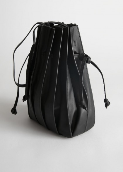 STORIES Pleated Leather Bucket Bag in Black | drawstring bags