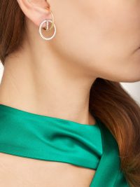 ANA KHOURI Brigid 18kt gold & diamond earrings | Matches Fashion | Ana Khouri looks to education in sculpture at the Fundação Armando Alvares Penteado in São Paulo for her fine jewellery offering | slim hoop that hugs the conch and features a circular drop encrusted with white-pavé