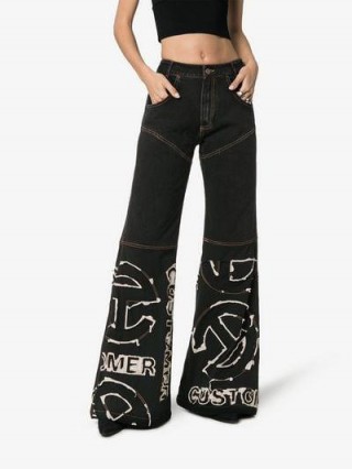 Telfar Contrast Logo Stitched Flared Jeans in Black