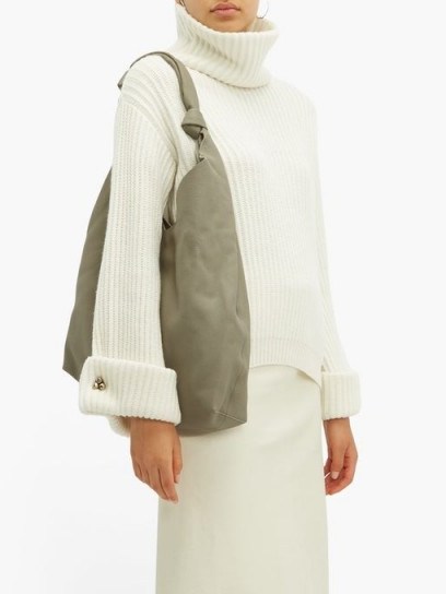 BRUNELLO CUCINELLI Faceted buttoned-cuff cashmere roll-neck sweater in cream | luxury roll neck sweaters - flipped