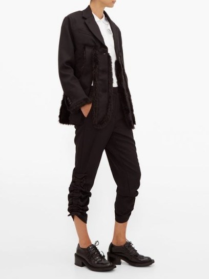 NOIR KEI NINOMIYA Ruched-cuff cropped wool trousers in black | side gathered pants - flipped