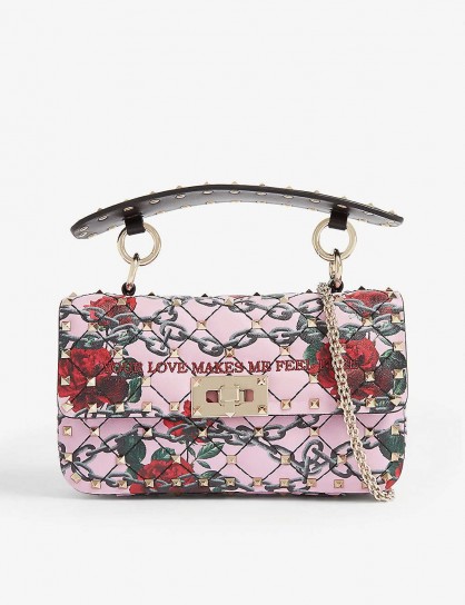 VALENTINO Rockstud Spike leather shoulder bag with ‘Your Love Makes Me Feel Free’ embroidered slogan in Macaron