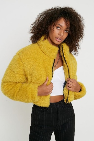UO Faux Fur Crop Puffer Jacket in yellow