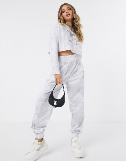 ASOS DESIGN tracksuit raw hem sweat / jogger in tie dye with placement print in grey - flipped
