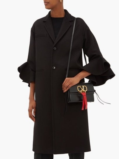 VALENTINO Ruffled-cuff single-breasted wool-blend coat in black ~ chic winter coats - flipped