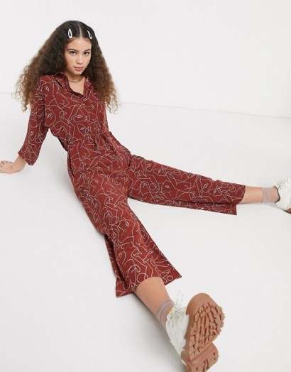 Monki Harriot face print wide leg jumpsuit in rust – abstract printed jumpsuits