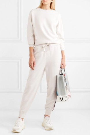 Jennifer Lopez white side stripe tracksuit, OLIVIA VON HALLE Missy Moscow striped silk and cashmere-blend sweatshirt and track pants set, out in Miami, 23 February 2020 | casual celebrity fashion