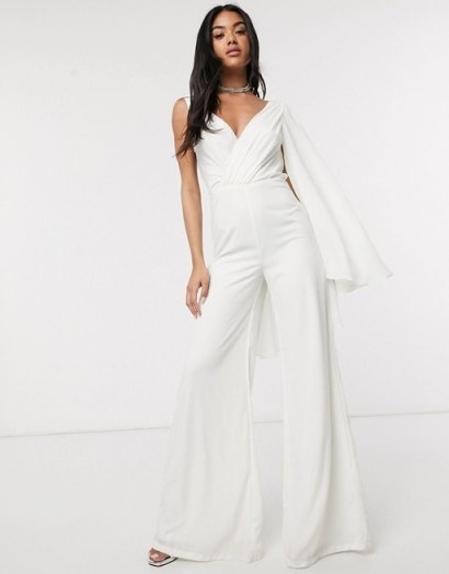 Yaura asymmetric caped plunge jumpsuit in ivory - flipped