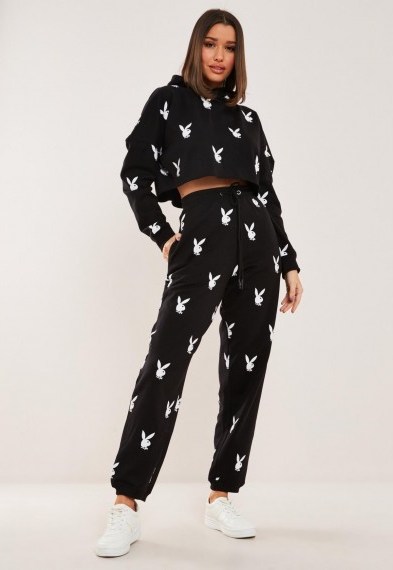 playboy x missguided black repeat print oversized joggers / printed jogging bottoms - flipped
