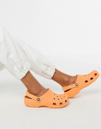 Crocs classic shoe in orange - flipped