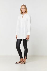 WYNNE SHIRT – Elka Collective – Crafted in a floaty linen lyocell blend – Feature seam detailing – Collarless neckline – Long-line silhouette with round hemline – Traditional shirt cuff