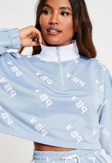 playboy x missguided blue repeat print zip through cropped sweatshirt / crop hem sweat top / bunny logo prints / bunnies - flipped