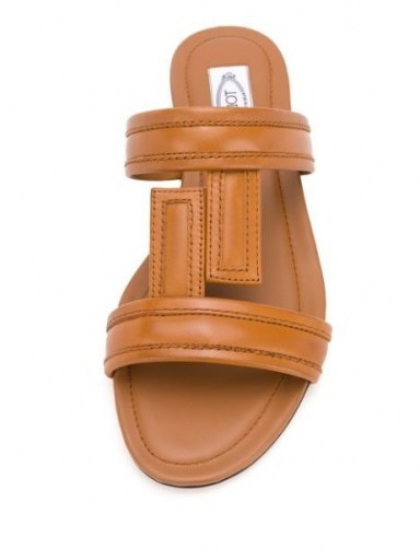 In the style of Olivia Culpo’s brown and cream flats on Instagram, Tod’s flat leather sandals in brown, 23 July 2020 | celebrity social media footwear - flipped