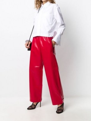 Kylie Jenner red leather trousers, out in LA, 11 August 2020, Bottega Veneta palazzo pants | celebrity street fashion | star style clothing