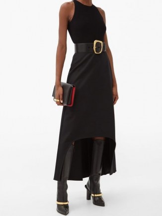 ALEXANDER MCQUEEN Dip-hem wool skirt in black / contemporary fashion / high low skirts