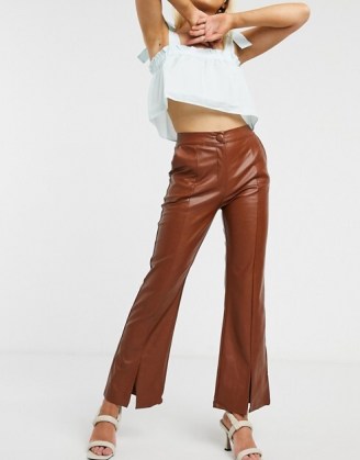 Ghospell tailored flared trousers in brown faux leather / split hem pants