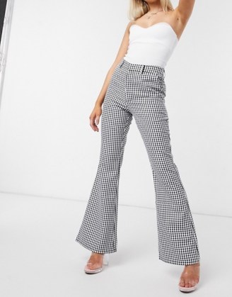 NA-KD houndstooth print flared trousers in black | checked flares - flipped