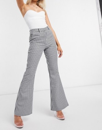 NA-KD houndstooth print flared trousers in black | checked flares