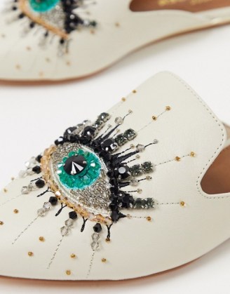 Kurt Geiger London Olive eye embellished flat slip on shoes in white leather | luxe style flats - flipped