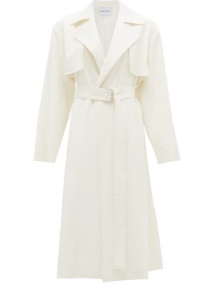 MICHELLE WAUGH The Carina oversized cotton-blend trench coat in ivory white | chic belted coats - flipped