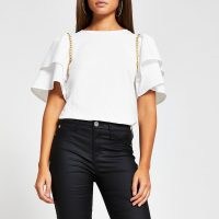 River Island Cream short sleeve frill chain detail t-shirt | embellished tee