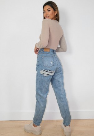 sarah ashcroft x missguided blue bum slash riot mom jeans | ripped bum | rip detail denim - flipped