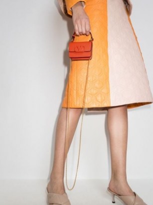 Valentino Garavani VSLING leather mini bag | tiny orange handbag - flipped