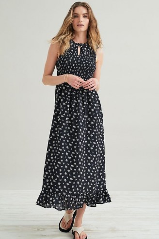 Kirei Smocked Maxi Dress / black floral sleeveless dresses with frill hem and front keyhole cut out