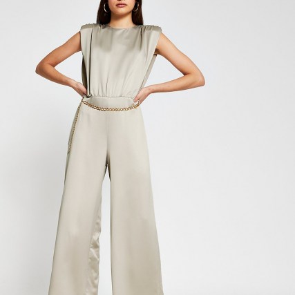 River Island Stone shoulder pad chain belted jumpsuit – glamorous luxe style jumpsuits for the evening