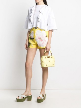Valentino Garavani small Roman Stud top handle bag in pale lime yellow | small luxe studded handbag - flipped
