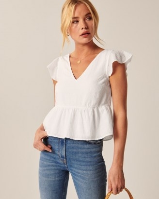 Abercrombie & Fitch Flutter Sleeve Trapeze Top | comfortable short-sleeve top in a soft linen-blend fabric and trapeze silhouette with on-trend flutter sleeves