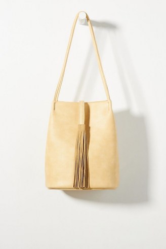 ANTHROPOLOGIE Tasseled Bucket Bag / womens stylish accessories / fringed detail shoulder bags