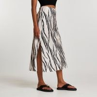 River Island Cream zebra bias midi skirt | split hem animal print skirts | womens trending fashion