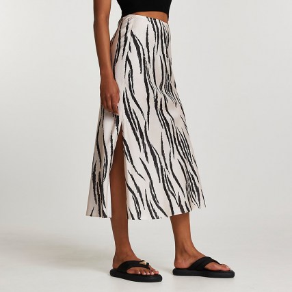 River Island Cream zebra bias midi skirt | split hem animal print skirts | womens trending fashion