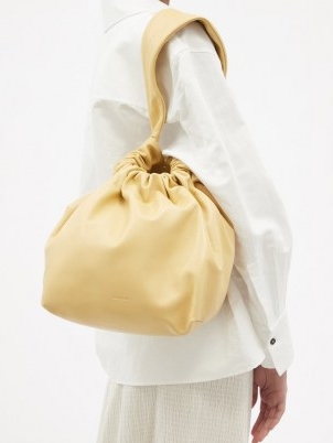 JIL SANDER Drawstring-top medium cream leather clutch / womens slouchy bags