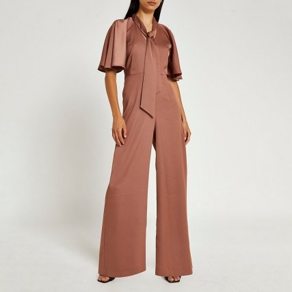 RIVER ISLAND Brown pussybow flute sleeve wide leg jumpsuit ~ neck tie angel sleeved jumpsuits - flipped