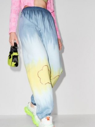 Collina Strada tie-dye rhinestone track pants blue / yellow ~ womens embellished cuff hem joggers ~ women’s cuffed jogging bottoms