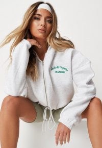MISSGUIDED hannah renée edit grey marl raquette embroidered zip through crop hoodie ~ womens hooded tops ~ women’s slogan hoodies